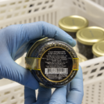 Checking the label on an Aquatir caviar jar
