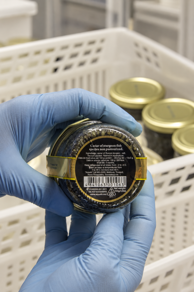 Checking the label on an Aquatir caviar jar